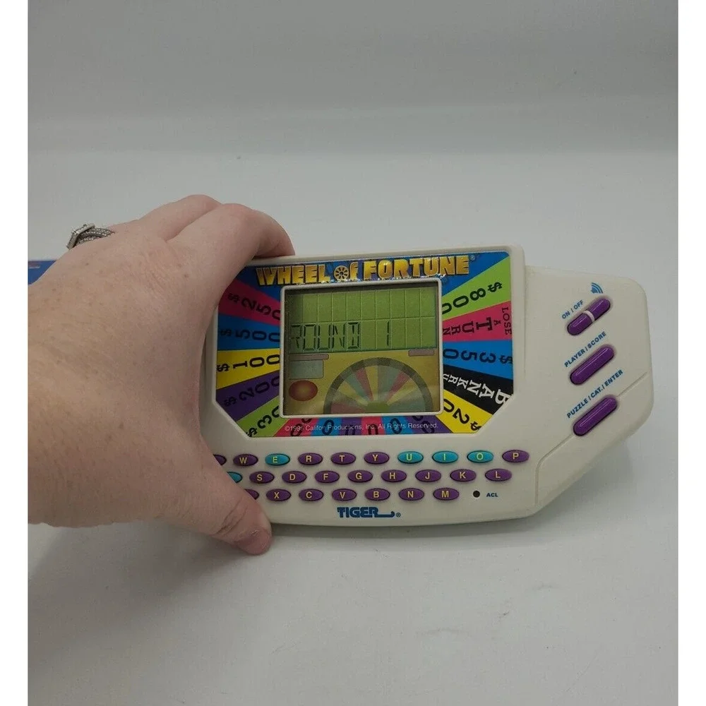 Vintage‎ 1995 Tiger Wheel of Fortune with 2 Cartridges Electronic Handheld Games